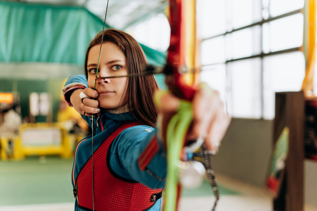 Focused archer at full draw preparing for a competition round