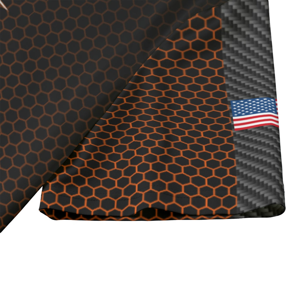 Close-up of the shooter jersey sleeve hem showing the orange hex print and the US flag on the sleeve