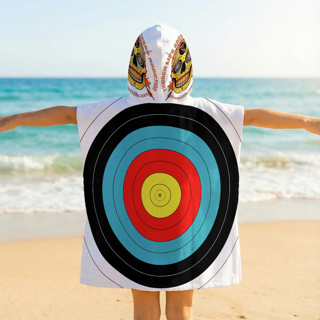 Back of the TLAA Target Kids' Towel Poncho worn by a child, showing the 10-ring target face and Sugar Skull art on the hood