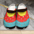 Pair of TLAA Target Clogs seen from the front, printed with a 10-ring archery target face in gold, red, blue and black