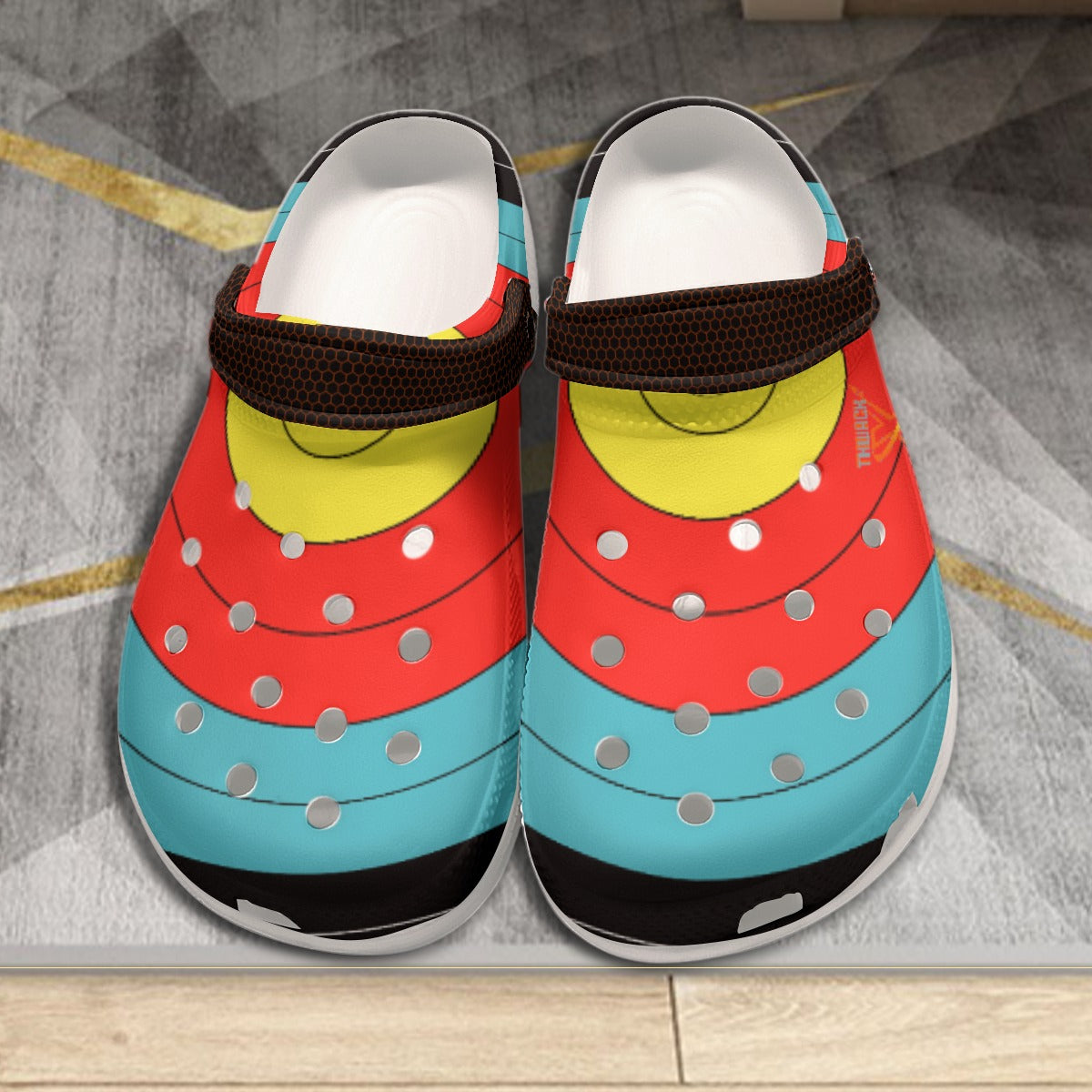 Pair of TLAA Target Clogs seen from the front, printed with a 10-ring archery target face in gold, red, blue and black