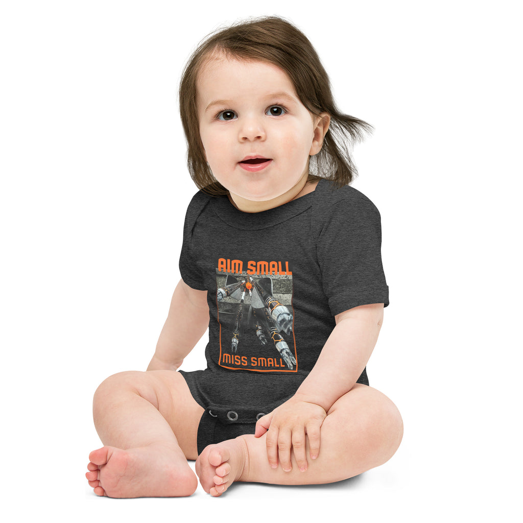 Aim Small Miss Small Baby Onesie in Dark Grey Heather, worn by a seated baby