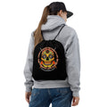 Sugar Skull Drawstring Bag, worn on the back of a model in a gray hoodie, showing the Sugar Skull inside the "I didn't choose the Thwack Life, the Thwack Life chose me" ring