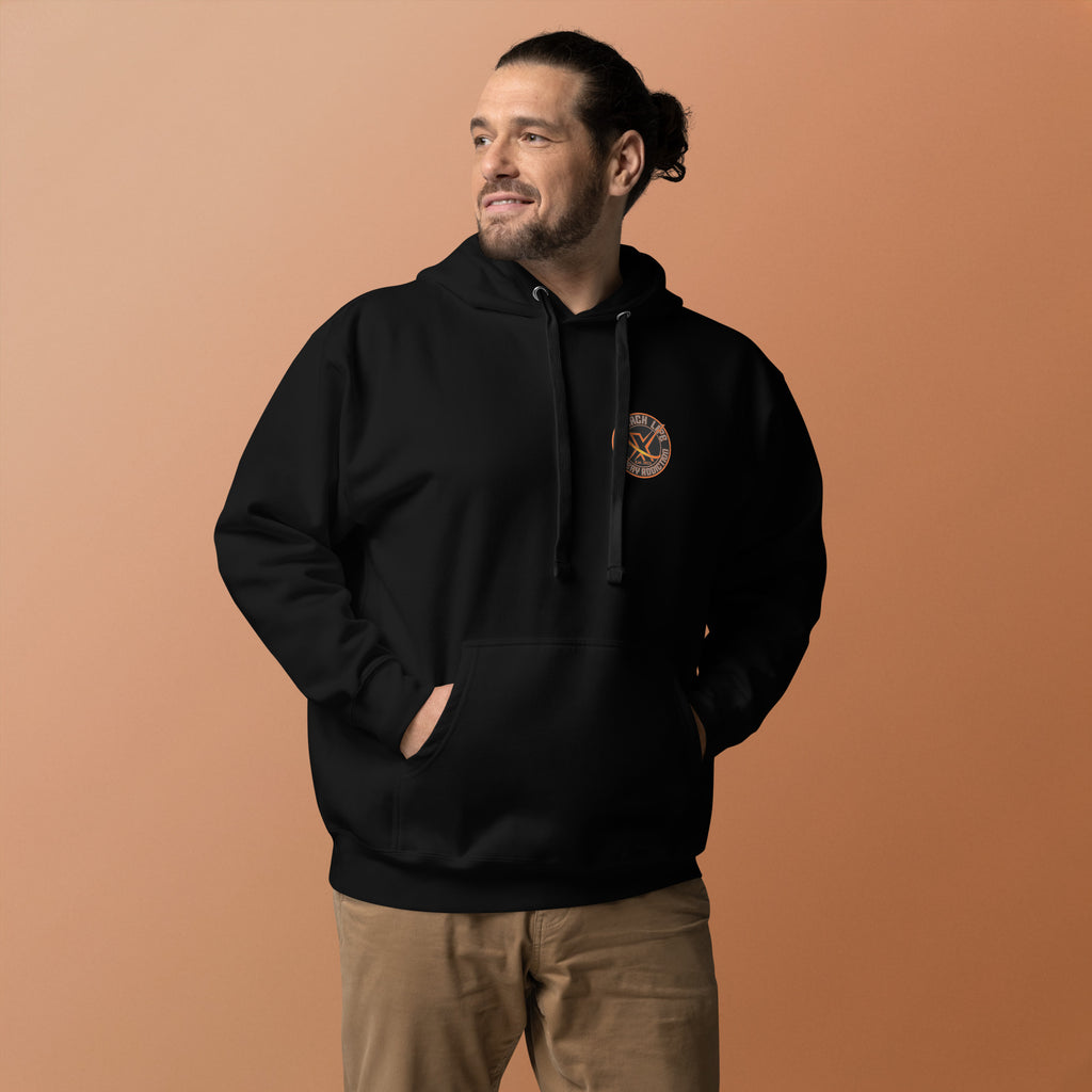 Sugar Skull Pullover Hoodie in Black, front view on a model against an orange backdrop