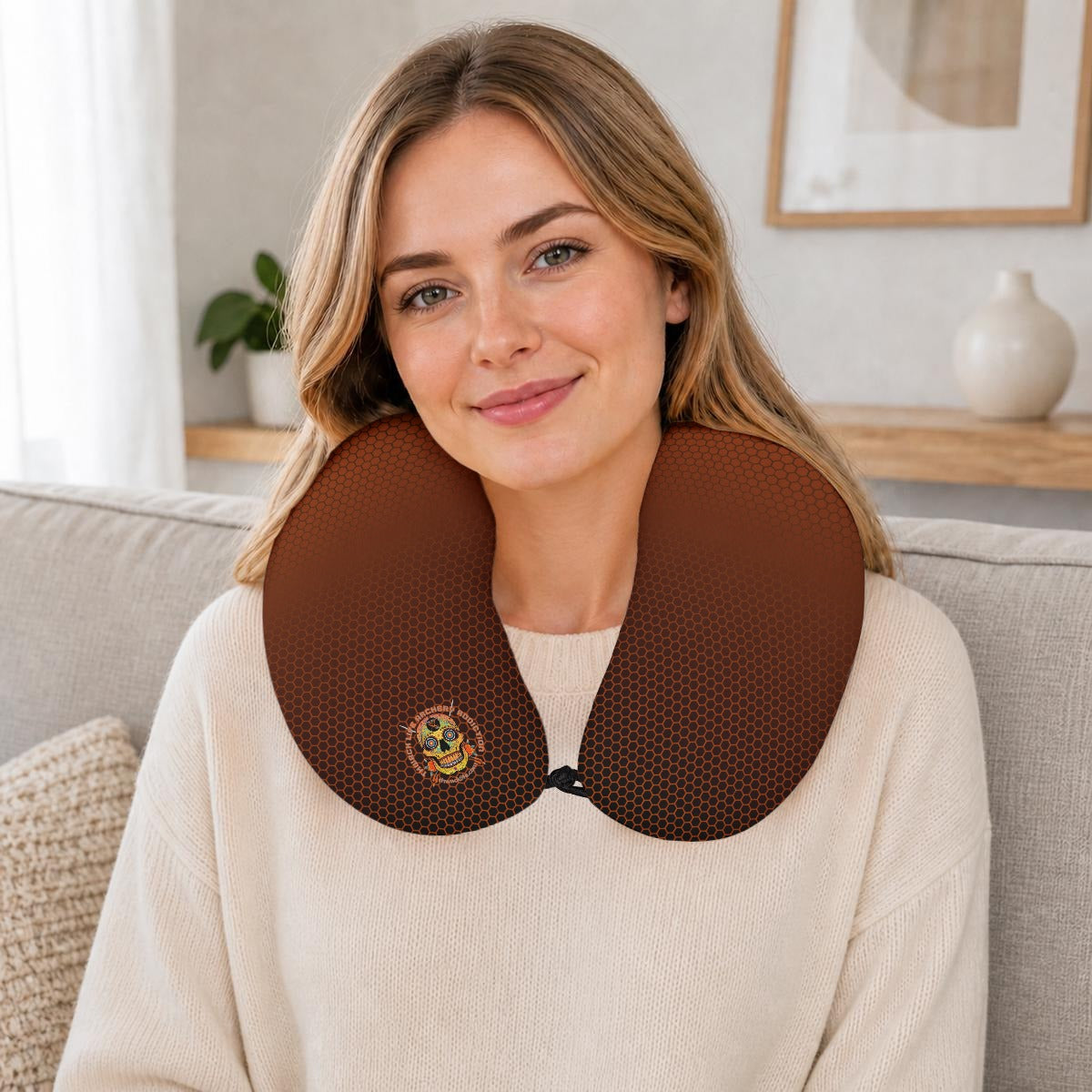 Sugar Skull Travel Neck Pillow, worn around the neck while seated on a couch