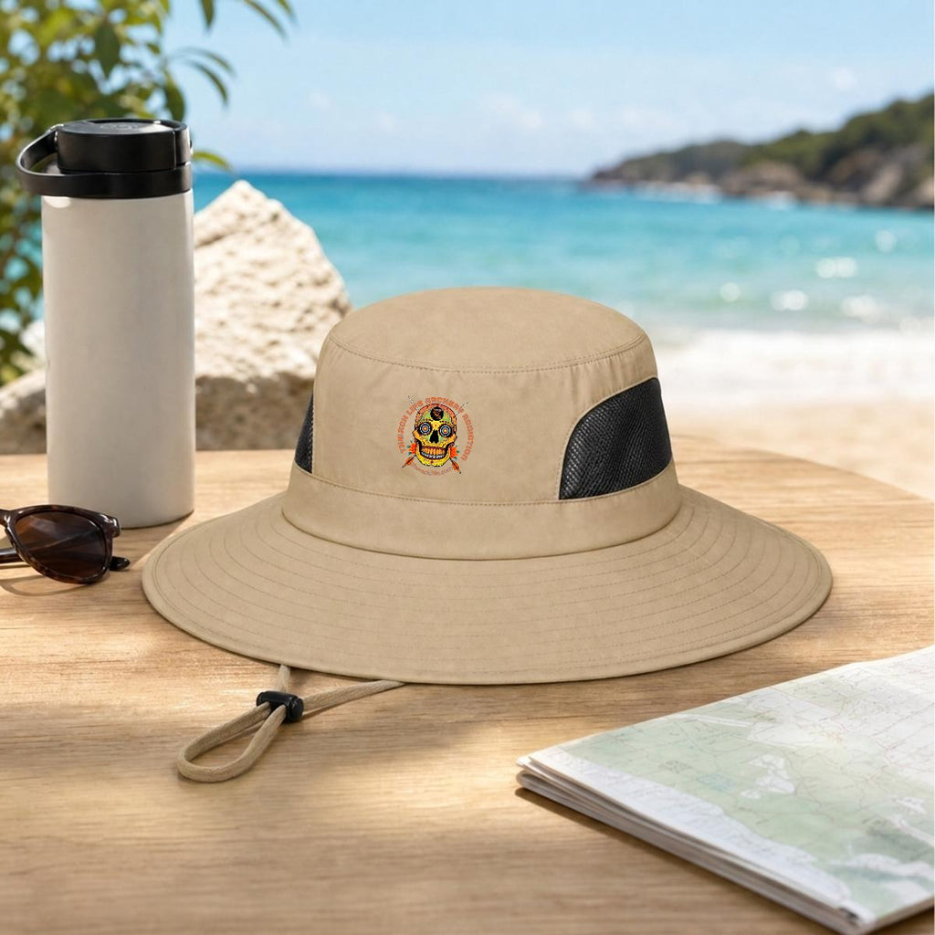 Sugar Skull Wide Brim Sun Hat in Coffee, on a table by the beach