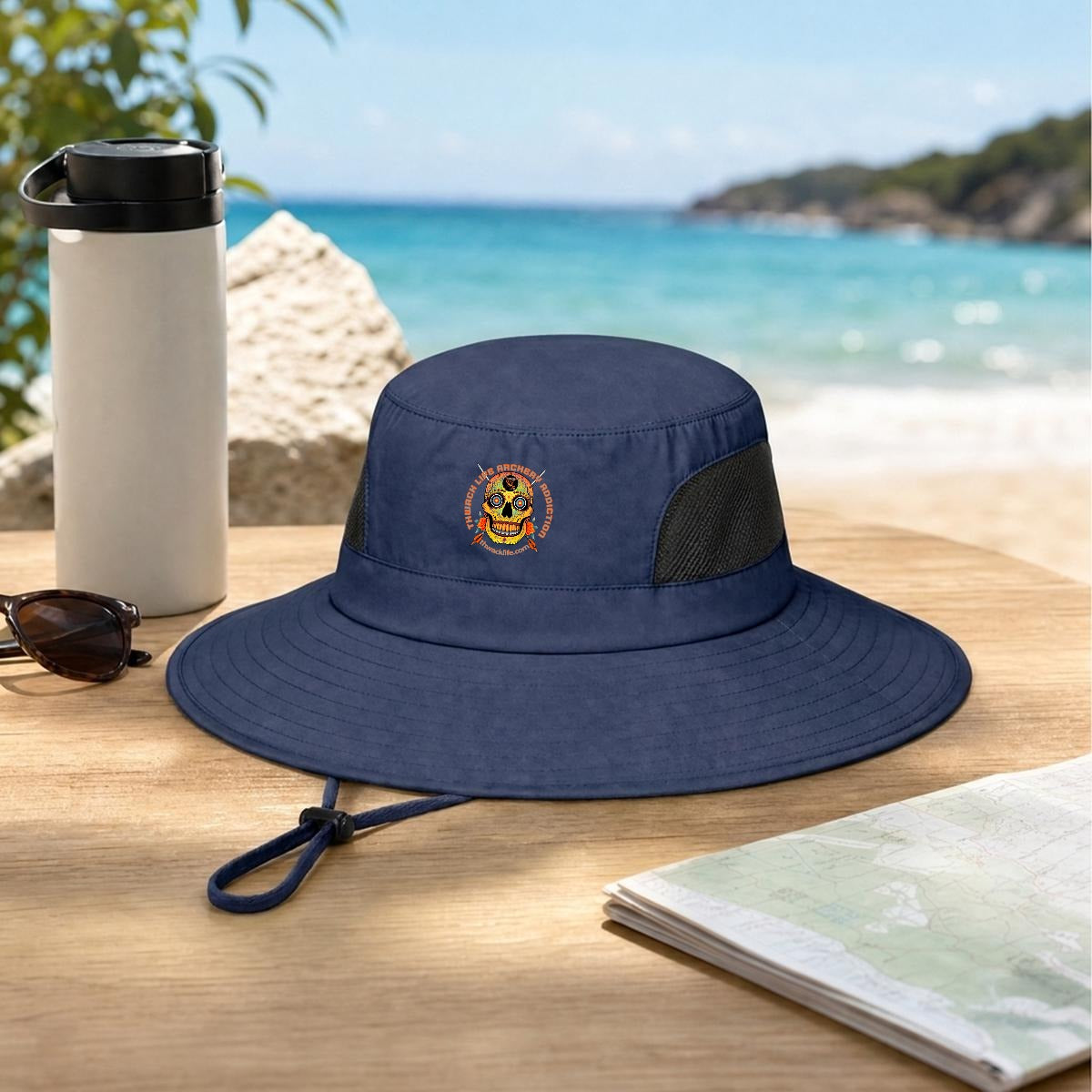 Sugar Skull Wide Brim Sun Hat in Dark Blue, on a table by the beach