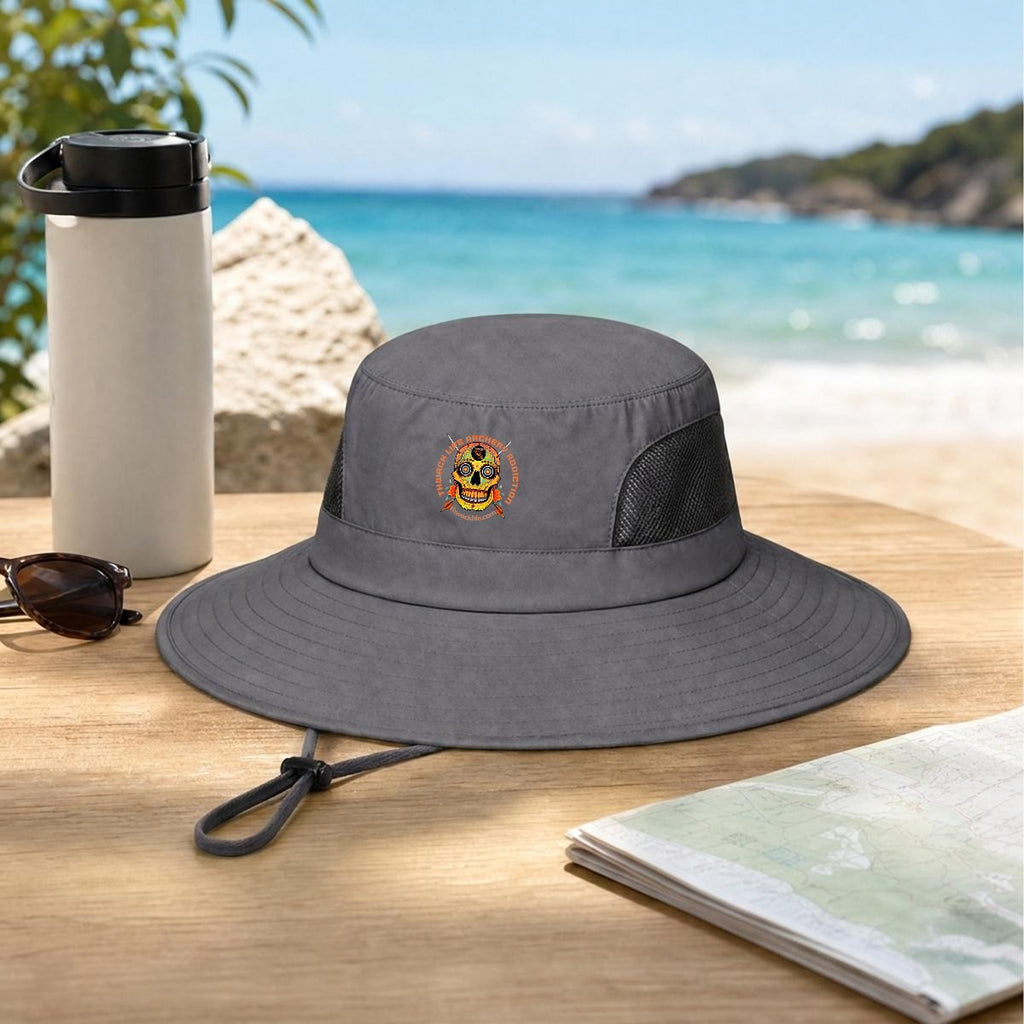 Sugar Skull Wide Brim Sun Hat in Gray, on a table by the beach