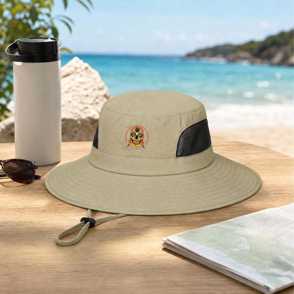 Sugar Skull Wide Brim Sun Hat in Khaki, on a table by the beach