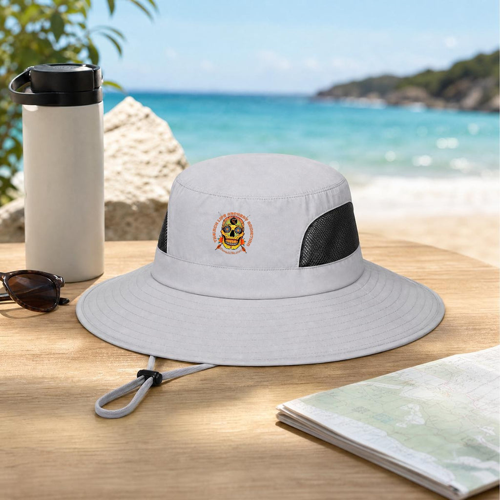 Sugar Skull Wide Brim Sun Hat in Light Gray, on a table by the beach