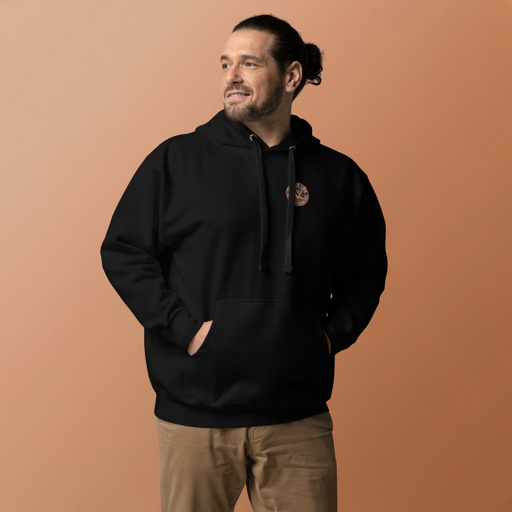 Thwack It Pullover Hoodie in Black, front view on a model against an orange backdrop