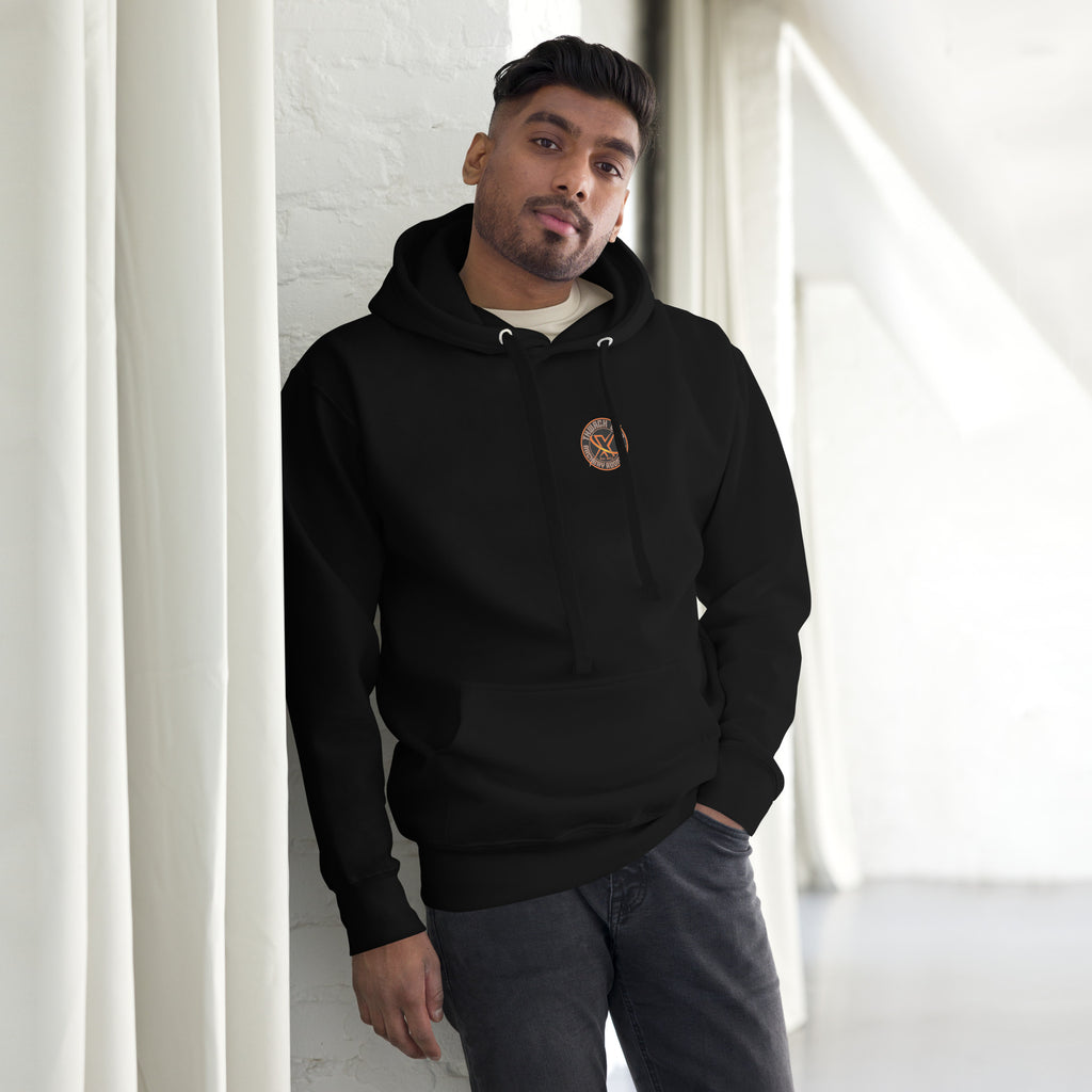 Thwack It Pullover Hoodie in Black, front view on a model with the small round chest logo