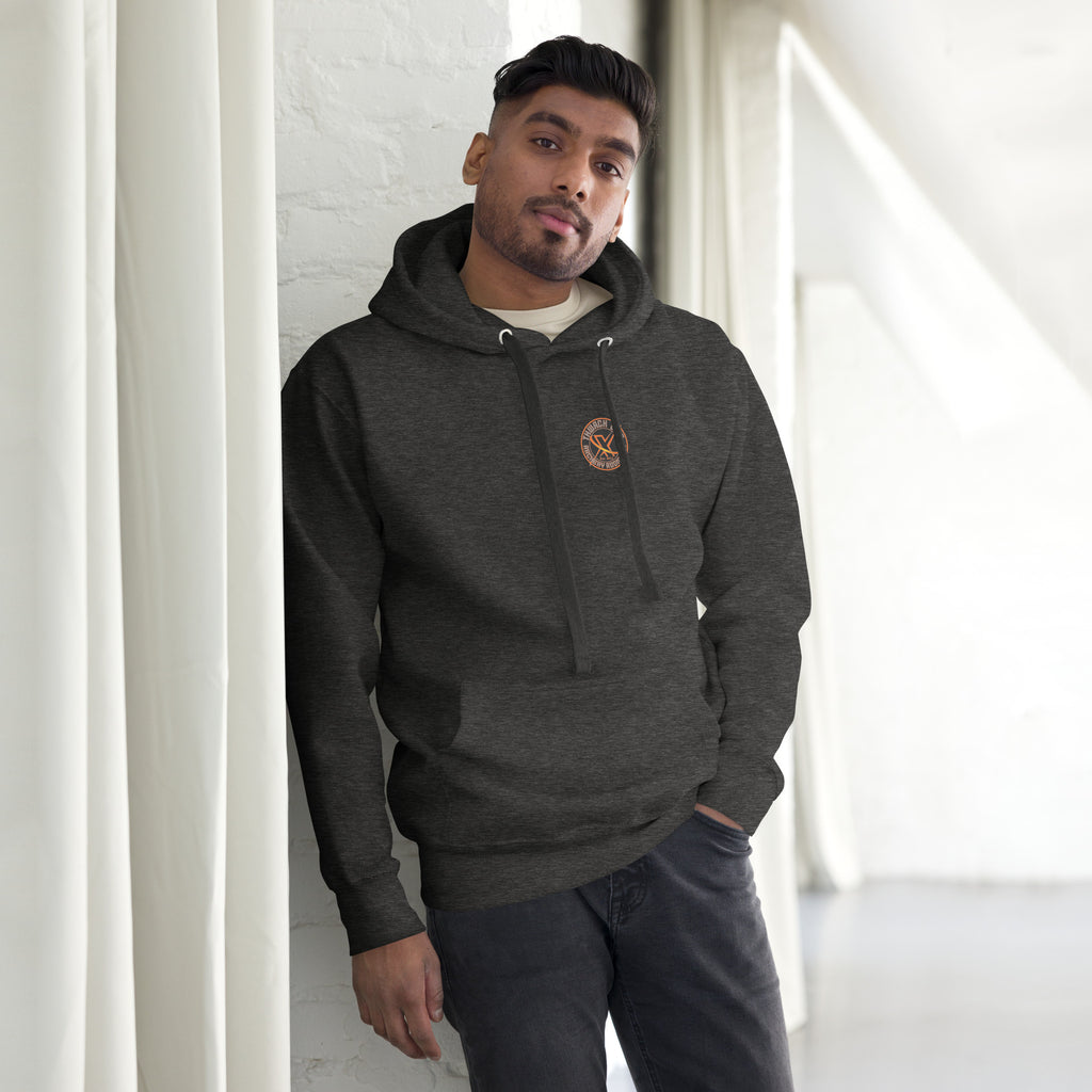Thwack It Pullover Hoodie in Charcoal Heather, front view on a model with the small round chest logo