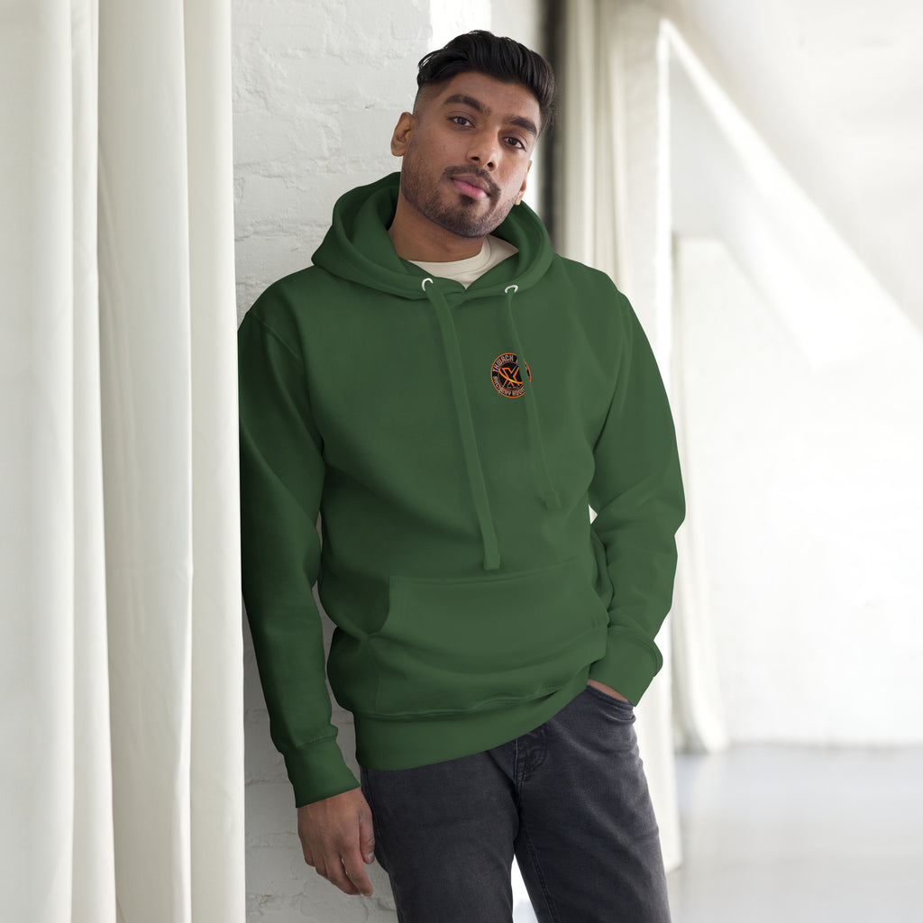 Thwack It Pullover Hoodie in Forest Green, front view on a model with the small round chest logo