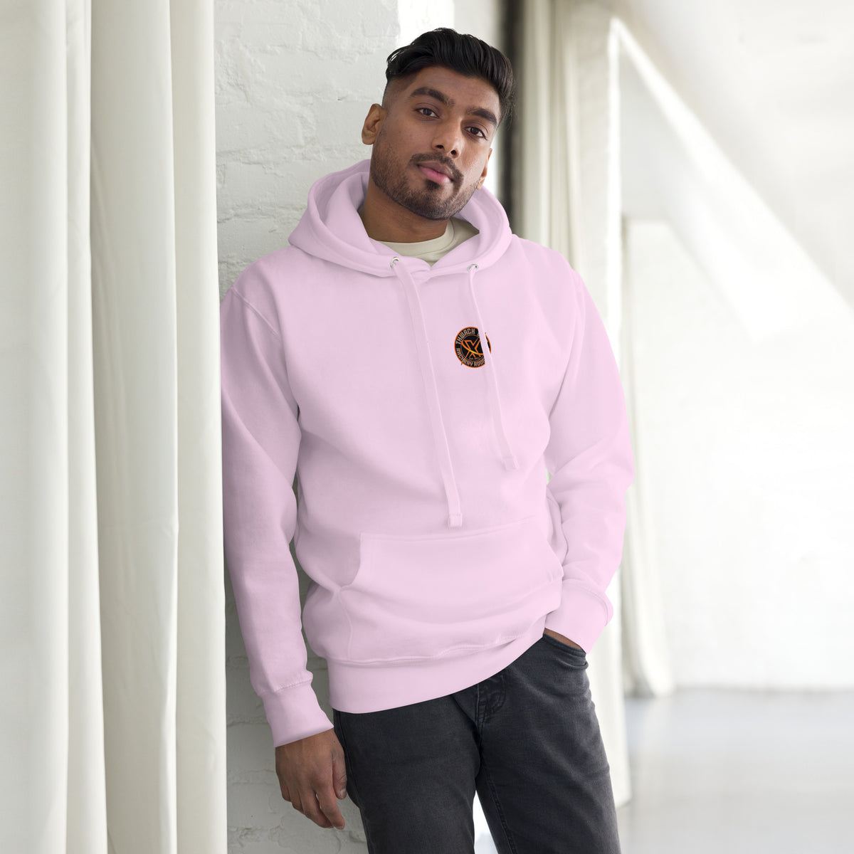 Thwack It Pullover Hoodie in Lavender, front view on a model with the small round chest logo
