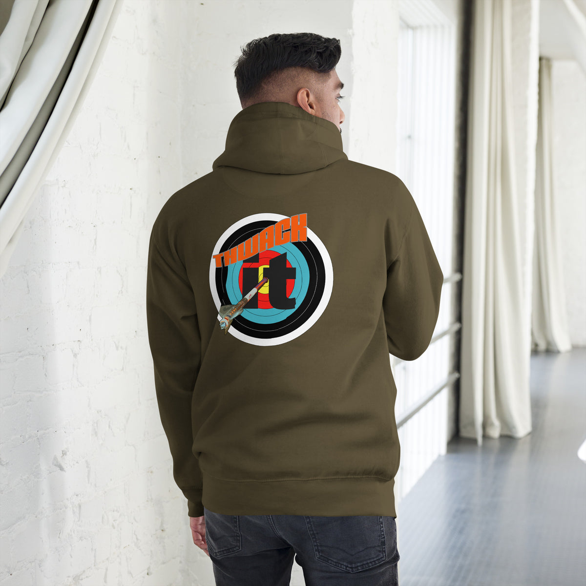 Thwack It Pullover Hoodie in Military Green, back view on a model showing the THWACK it target-and-arrow design