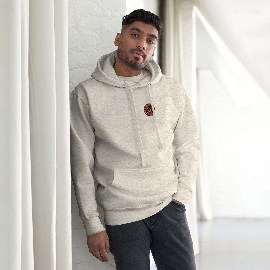 Thwack It Pullover Hoodie in Oatmeal Heather, front view on a model with the small round chest logo