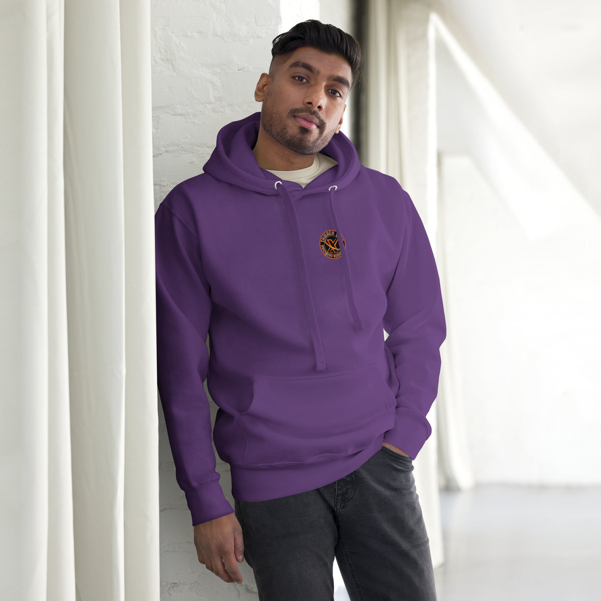 Thwack It Pullover Hoodie in Purple, front view on a model with the small round chest logo