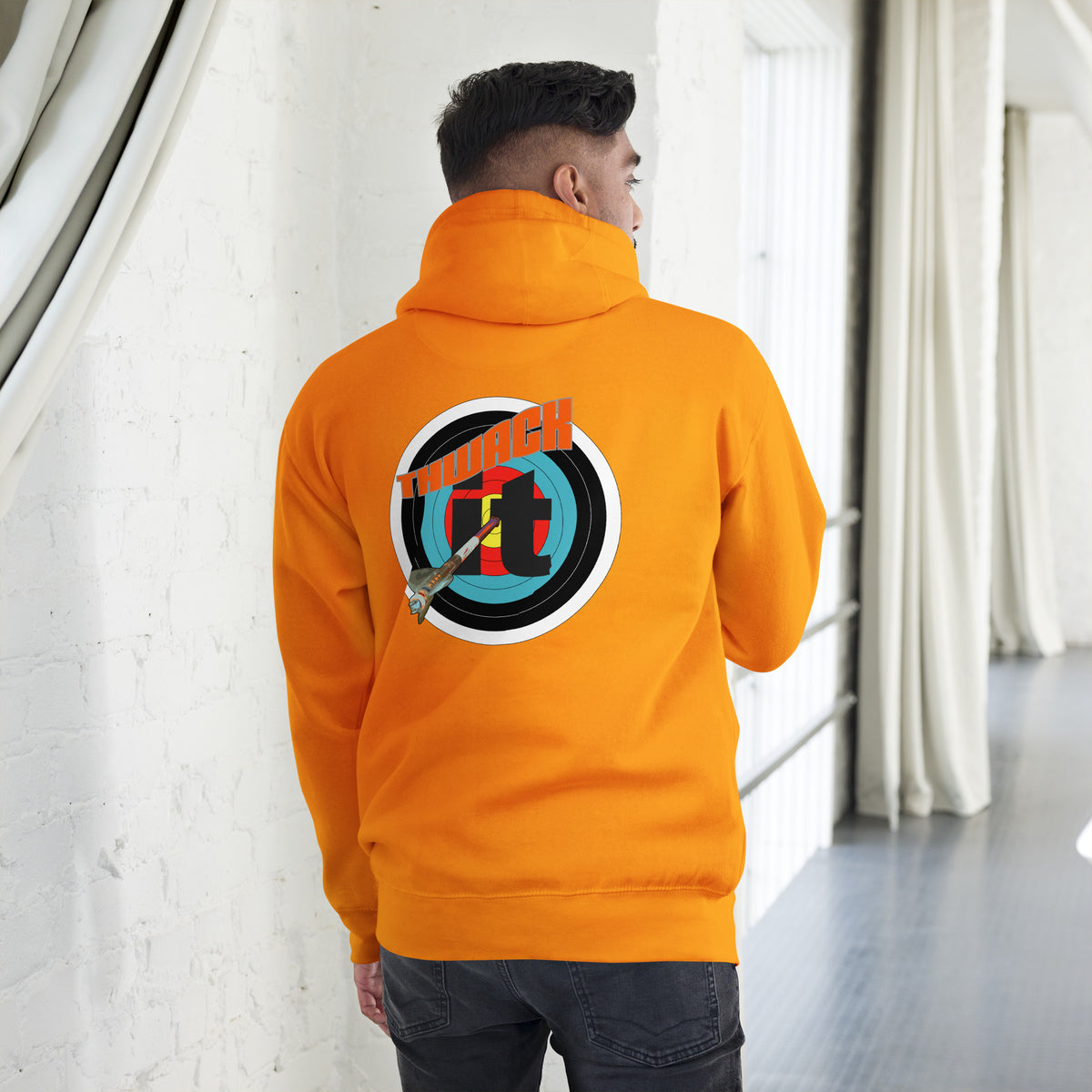 Thwack It Pullover Hoodie in Team Gold, back view on a model showing the THWACK it target-and-arrow design